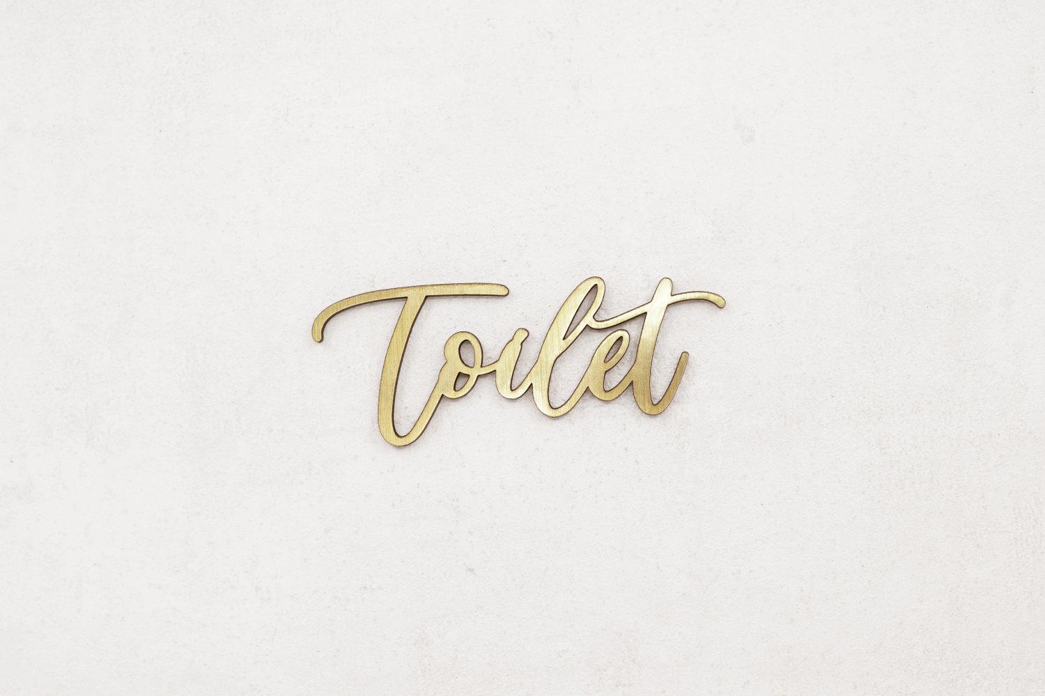 Udskåret toiletskilt i guld
